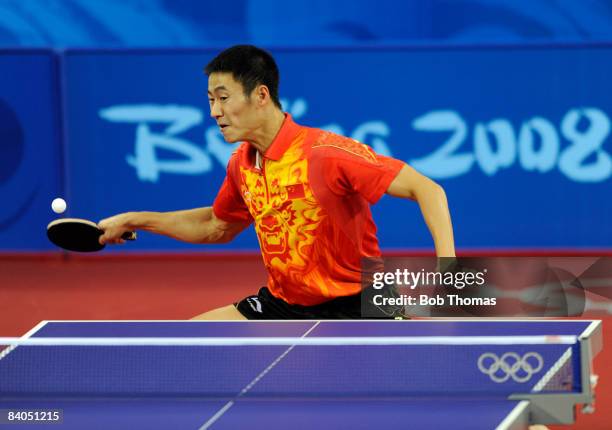 Liqin Wang of China plays a shot in the Quarter Final of the Men's Singles Table Tennis event against Ruiwu Tan of Croatia held at the Peking...