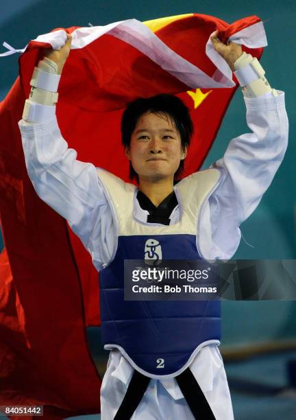 Jingyu Wu of China celebrates after winning the Women's Gold Medal taekwondo -49kg at the University of Science and Technology Gymnasium during Day...
