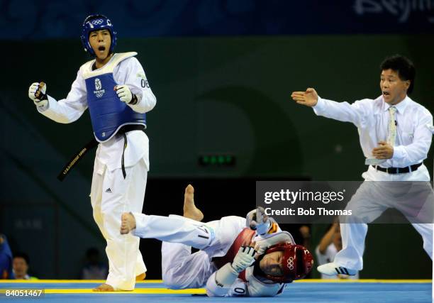 Rohullah Nikpai of Afganistan against Juan Antonio Ramos of Spain during the Men's bronze medal taekwondo match -58kg at the University of Science...