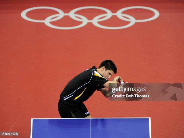 Dimitrij Ovtcharov of Germany plays against Adrian Crisan of Romania during their men's table tennis single preliminary match during Day 12 of the...