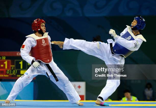 Mu-Yen Chu of Taipei against Pedro Povoa of Portugal during the Men's taekwondo -58kg at the University of Science and Technology Gymnasium during...