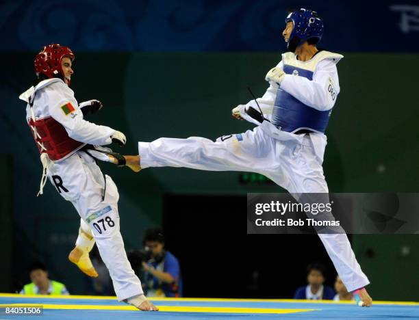 Mu-Yen Chu of Taipei against Pedro Povoa of Portugal during the Men's taekwondo -58kg at the University of Science and Technology Gymnasium during...