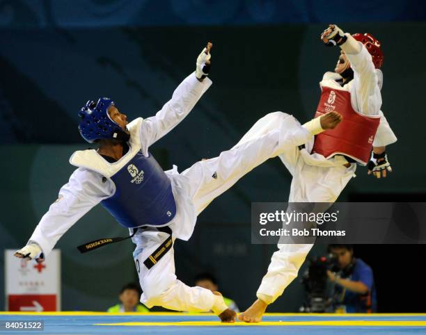 Yulis Gabriel Mercedes of the Dominican Republic against Juan Antonio Ramos of Spain during the Men's taekwondo -58kg at the University of Science...