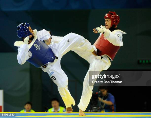 Yulis Gabriel Mercedes of the Dominican Republic against Juan Antonio Ramos of Spain during the Men's taekwondo -58kg at the University of Science...