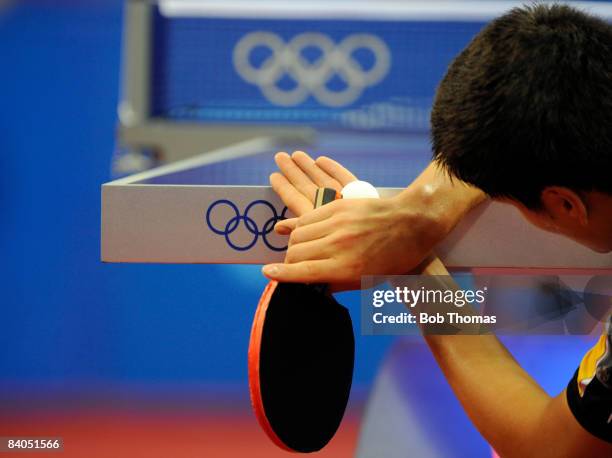 Dimitrij Ovtcharov of Germany plays against Adrian Crisan of Romania during their men's table tennis single preliminary match during Day 12 of the...