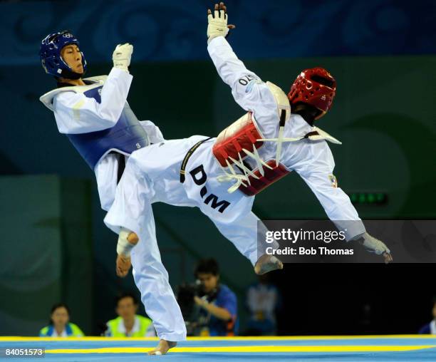Mu-Yen Chu of Taipei against Yulis Gabriel Mercedes of the Dominican Republic during the Men's taekwondo -58kg at the University of Science and...
