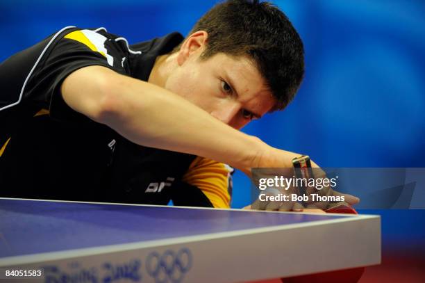 Dimitrij Ovtcharov of Germany plays against Adrian Crisan of Romania during their men's table tennis single preliminary match during Day 12 of the...