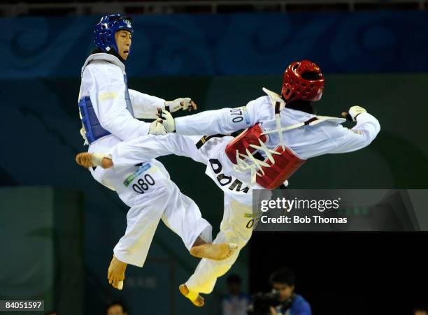 Mu-Yen Chu of Taipei against Yulis Gabriel Mercedes of the Dominican Republic during the Men's taekwondo -58kg at the University of Science and...