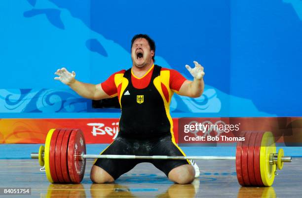Matthias Steiner of Germany celebrates winning the gold medal in the Men's 105 kg group weightlifting event at the Beijing University of Aeronautics...