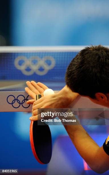 Dimitrij Ovtcharov of Germany plays against Adrian Crisan of Romania during their men's table tennis single preliminary match during Day 12 of the...