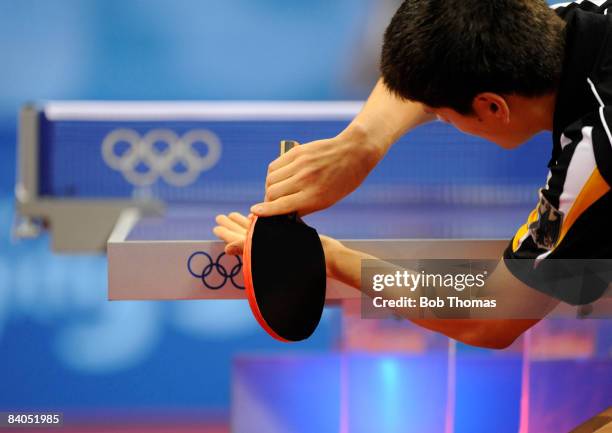 Dimitrij Ovtcharov of Germany plays against Adrian Crisan of Romania during their men's table tennis single preliminary match during Day 12 of the...