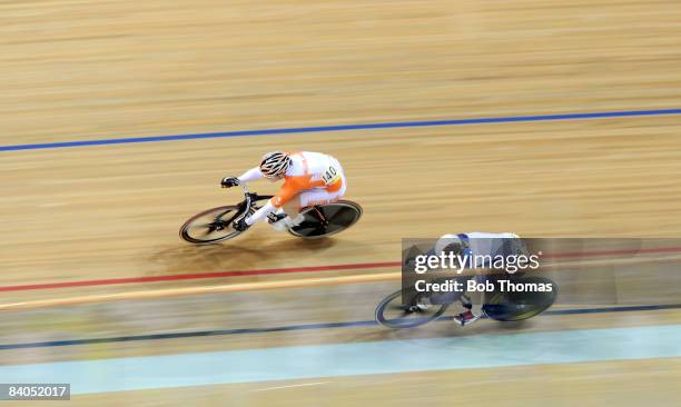 Willy Kanis of Holland with Jennie Reed of the USA during the Women's Sprint Quarter Finals event at the Laoshan Velodrome on Day 10 of the Beijing...