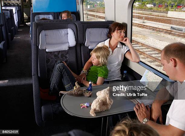 family on train - train denmark stock pictures, royalty-free photos & images