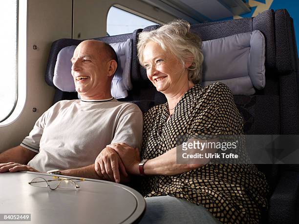 couple on train - train denmark stock pictures, royalty-free photos & images