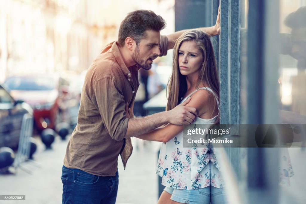 Young couple in the middle of relationship conflict