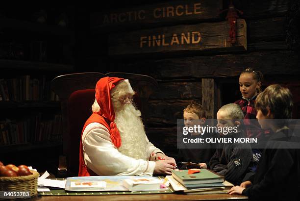 Santa Claus listens to childrens' wish lists', in his "office" in Rovaniemi, on December 16, 2008. Rovaniemi's Christmas theme park is in full swing,...