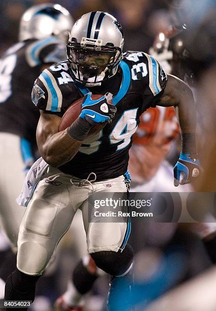 DeAngelo Williams of the Carolina Panthers carries the ball against the Tampa Bay Buccaneers on December 8, 2008 at Bank of America Stadium in...