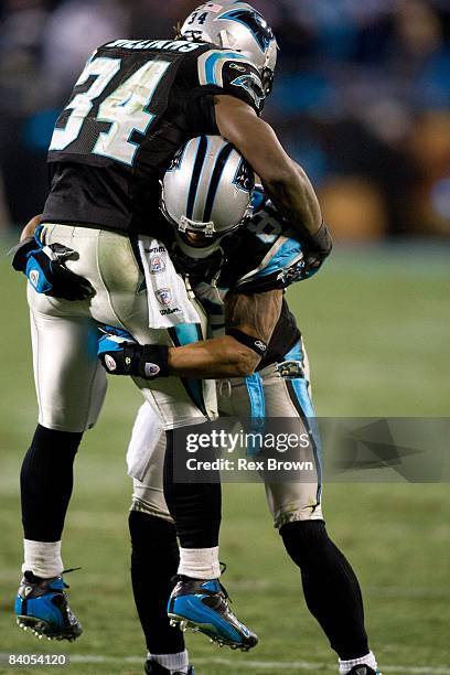 DeAngelo Williams of the Carolina Panthers celebrates with teammate Steve Smith after a scoring a touchdown against the Tampa Bay Buccaneers on...