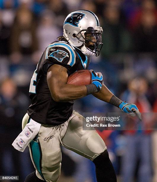 DeAngelo Williams of the Carolina Panthers carries for a first down against the Tampa Bay Buccaneers on December 8, 2008 at Bank of America Stadium...