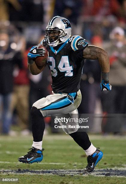 DeAngelo Williams of the Carolina Panthers carries for a first down against the Tampa Bay Buccaneers on December 8, 2008 at Bank of America Stadium...