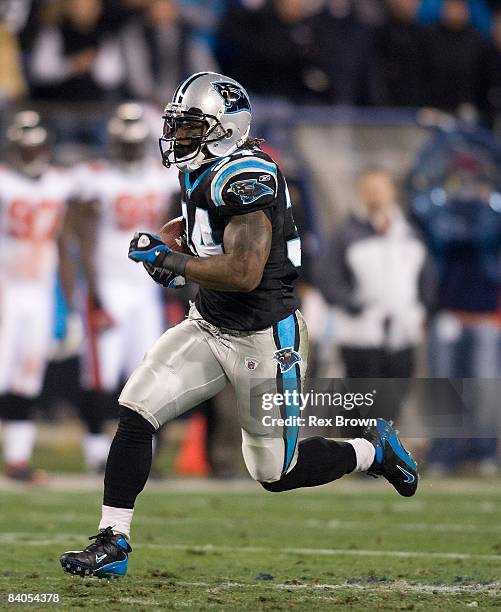 DeAngelo Williams of the Carolina Panthers carries for a first down against the Tampa Bay Buccaneers on December 8, 2008 at Bank of America Stadium...