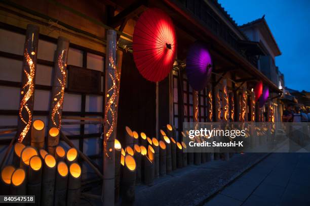 bamboo and paper umbrella candle lights in obon night event in japan - obon stock pictures, royalty-free photos & images