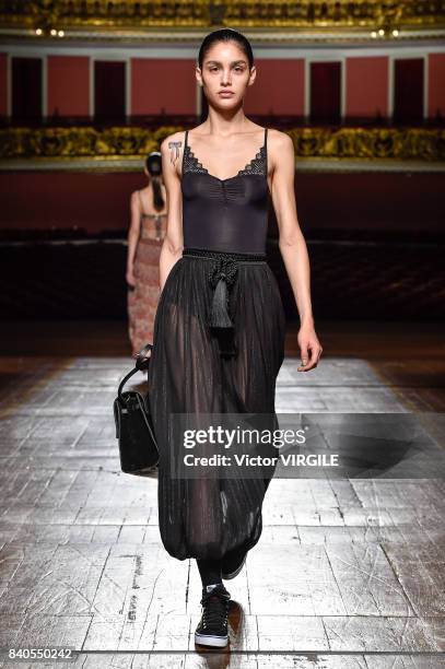 Model walks the runway during A La Garconne fashion show as part of Sao Paulo N44 Fashion Week Spring/Summer 2018 on August 26, 2017 in Sao Paulo,...