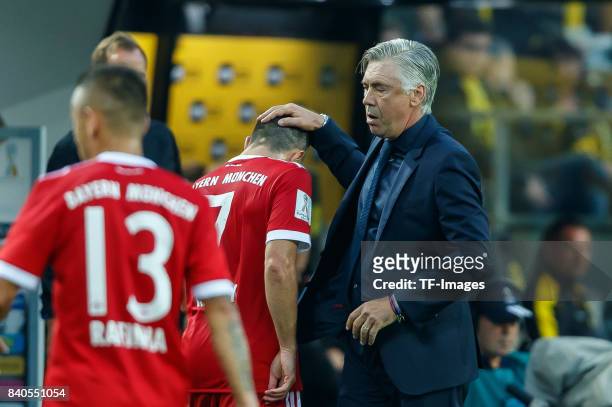 Head coach Carlo Ancelotti of Muenchen shakes hands with Franck Ribery of Muenchen during the DFL Supercup 2017 match between Borussia Dortmund and...