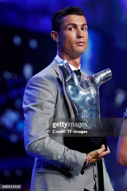 Cristiano Ronaldo of Real Madrid poses with his trophy of Best Men's player in Europe during the UEFA Champions League Group stage draw ceremony, at...