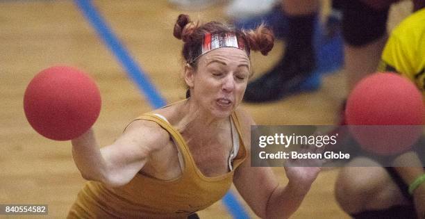 Player throws a ball as she is about to be hit by one at the Elite Dodgeball National Championships at Boston University on Aug. 17, 2017. More than...