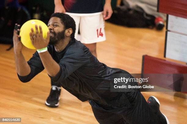 Vince Marchbanks, a 32-year-old architect from Los Angeles, snares a ball that bounced off his chest, eliminating an opponent at the Elite Dodgeball...
