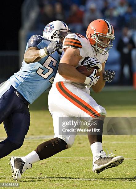 Steve Heiden of the Cleveland Browns is tackled by Stephen Tulloch of the Tennessee Titans at LP Field on December 7, 2008 in Nashville, Tennessee....