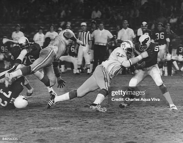 San Diego Chargers Hall of Fame defensive end Deacon Jones sacks Philadelphia Eagles quarterback Roman Gabriel during a preseason game in 1973.