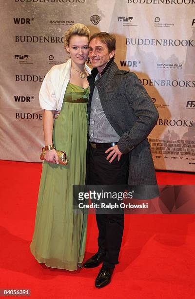 Actor Andre Hennicke and his girlfriend Denise Gebhardt arrive for the Buddenbrooks premiere at the Lichtburg cinema on December 16, 2008 in Essen,...