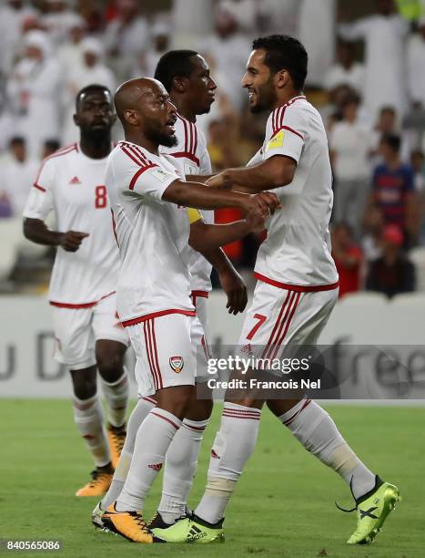 Ali Ahmed Mabkhout of UAE celebrates with Ismail Matar after scoring his teams first goal during the FIFA 2018 World Cup qualifying match between...