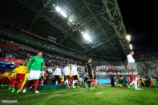 The two teams walk out ahead of the FIFA Confederations Cup Russia 2017 Semi-Final match between Germany and Mexico at Fisht Olympic Stadium on June...