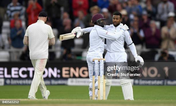 West Indies batsman Shai Hope celebrates his century with Jermaine Blackwood during day five of the 2nd Investec Test Match between England and West...