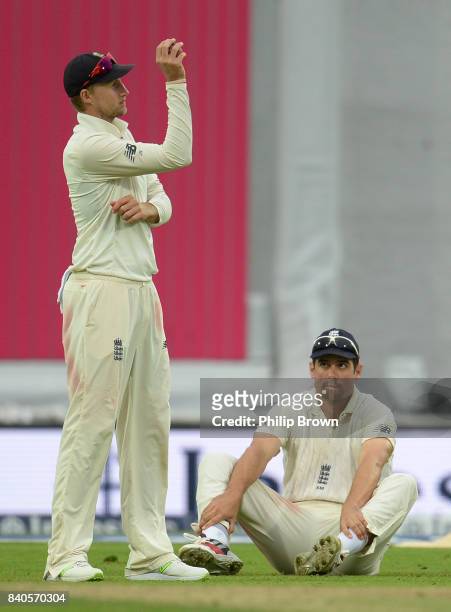 Alastair Cook of England reacts with Joe Root after dropping Shai Hope of the West Indies runs during the fifth day of the 2nd Investec Test match...
