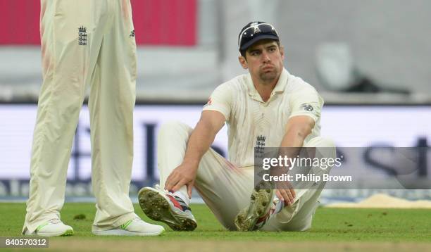 Alastair Cook of England reacts after dropping Shai Hope of the West Indies runs during the fifth day of the 2nd Investec Test match between England...