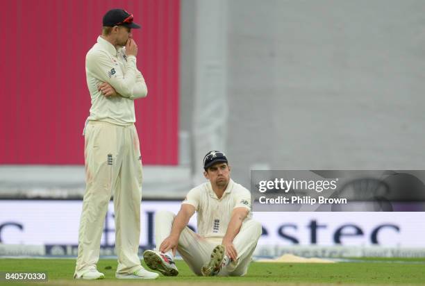 Alastair Cook of England reacts with Joe Root after dropping Shai Hope of the West Indies runs during the fifth day of the 2nd Investec Test match...