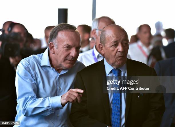 Medef head Pierre Gattaz and French Foreign Minister Jean-Yves Le Drian attend the French employers association Medef summer University meeting in...