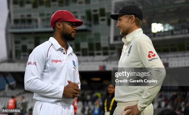 Shai Hope of the West Indies speaks with England captain Joe Root after the 2nd Investec Test between England and the West Indies at Headingley on...