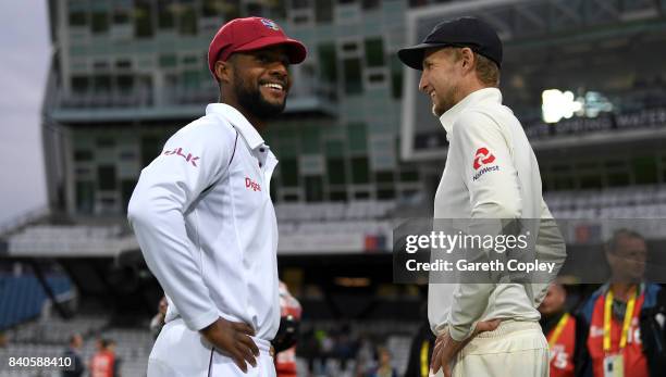 Shai Hope of the West Indies speaks with England captain Joe Root after the 2nd Investec Test between England and the West Indies at Headingley on...