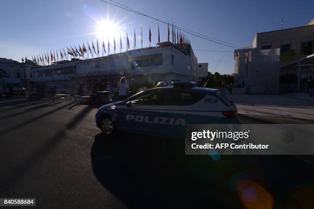 Police car patrols in front of the Palazzo del Cinema on the eve of the opening ceremony of the 74th Venice Film Festival on August 29, 2017 at...