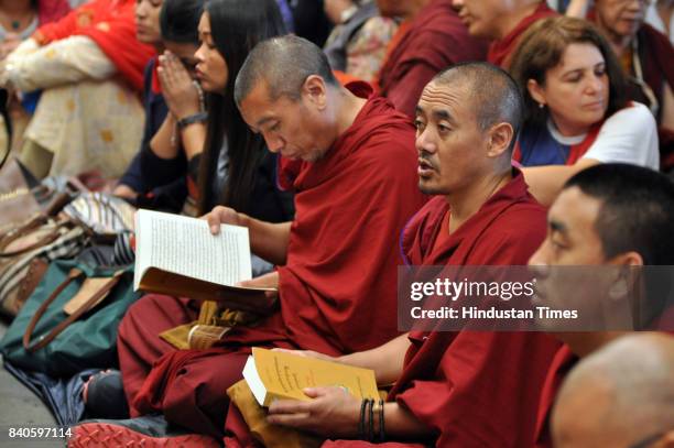 Devotees listen to Tibetan spiritual leader the Dalai Lama, unseen, at the Tsuglakhang Temple on August 29, 2017 in Dharamsala, India. The Tibetan...