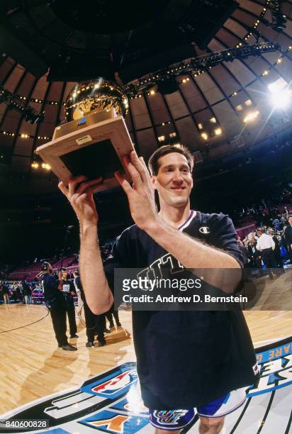 Jeff Hornacek of the Utah Jazz hoists the trophy after winning the three point contest as part of NBA All-Star Weekend on February 7, 1998 at Madison...