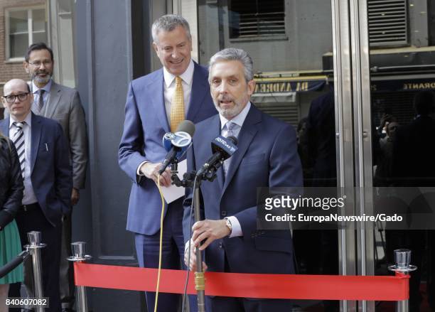 Real estate developed Charles S Cohen delivers a speech, with New York City mayor Bill De Blasio in the background, at a ribbon cutting ceremony in...