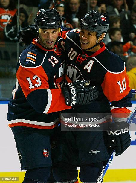 Richard Park of the New York Islanders celebrates his second period goal with Bill Guerin against the Washington Capitals on December 16, 2008 at...