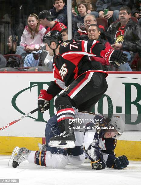 Jim Slater of the Atlanta Thrashers gets pinned to the ice by Jarkko Ruutu of the Ottawa Senators at Scotiabank Place on December 16, 2008 in Ottawa,...