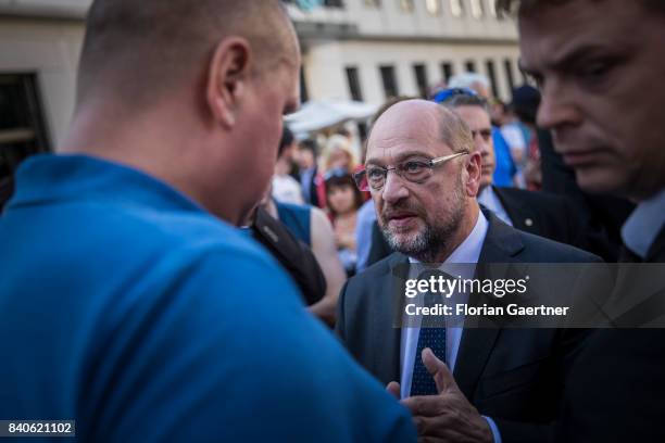 Candidate for the german chancellorship of the Social Democratic Party of Germany , Martin Schulz, talks with visitors before the speech of his...